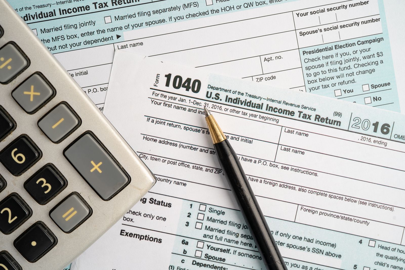 Form 1040 with a calculator