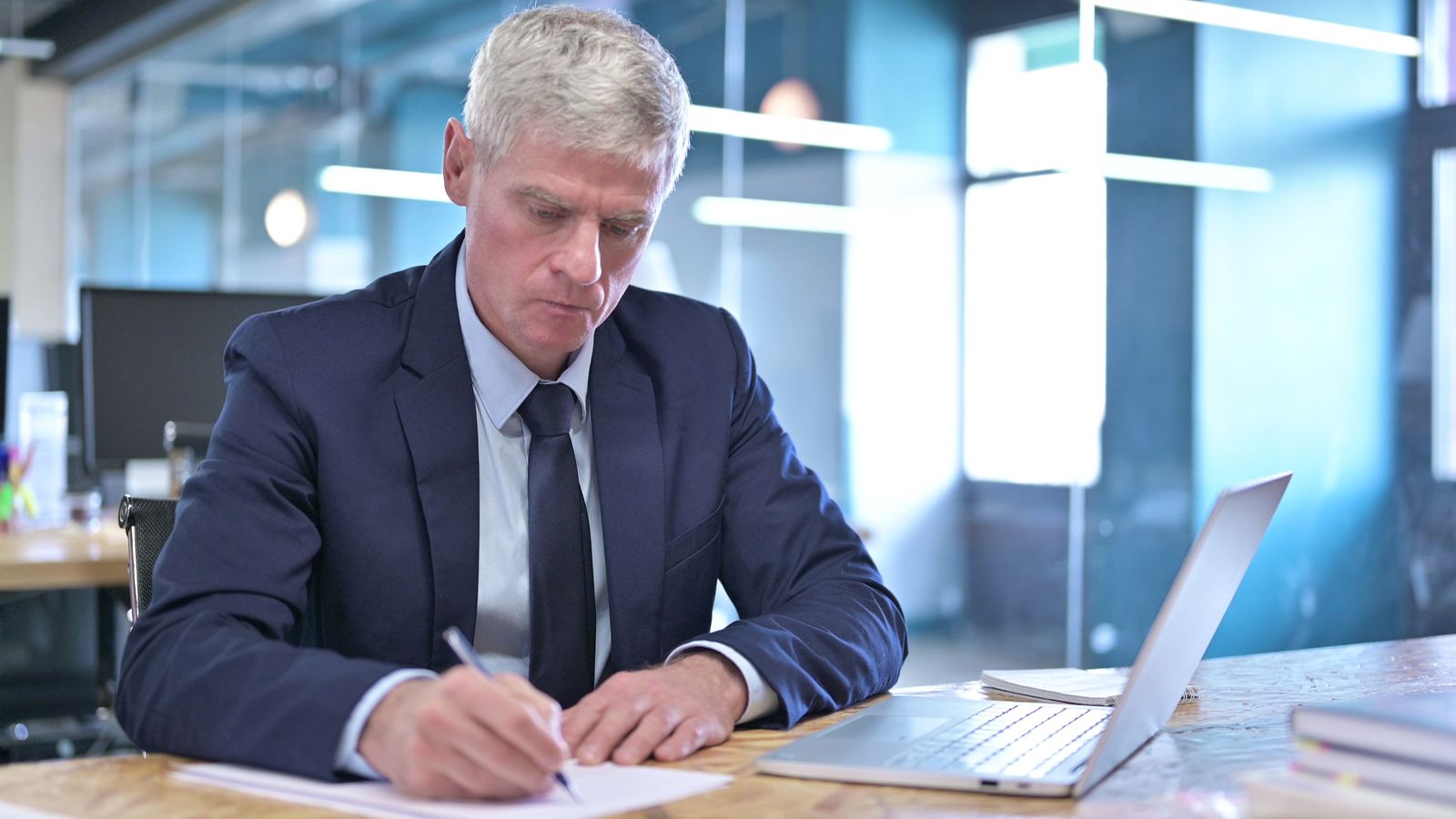 A man signing a document